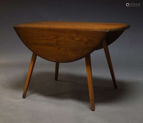 Ercol, a model 384 elm and beech drop leaf dining table, c.1...