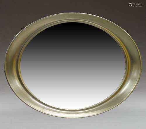A contemporary wall mirror, of recent manufacture with oval ...