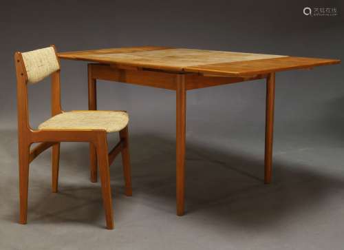 A teak extending dining table, c.1960, the rectangular top w...