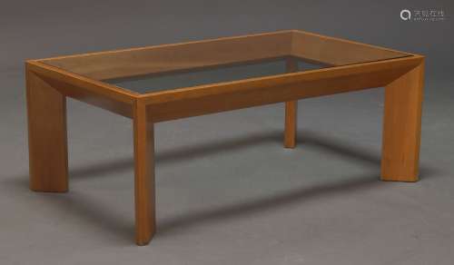 A modern cherry wood and glazed coffee table, the rectangula...