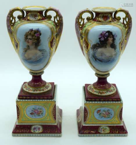 A PAIR OF EARLY 20TH CENTURY AUSTRIAN TWIN HANDLED PORCELAIN...