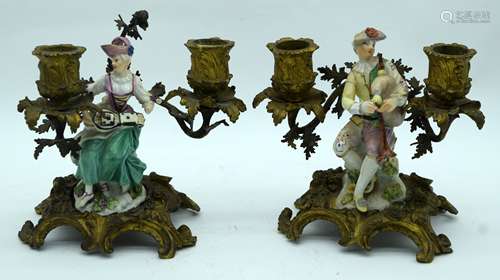 A RARE PAIR OF 18TH CENTURY EUROPEAN PORCELAIN FIGURES upon ...