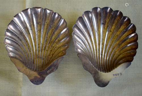 A PAIR OF SILVER SHELL FORM BUTTER DISHES of naturalistic in...