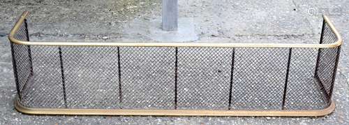 AN ANTIQUE BRASS FENDER. 120 cm x 27 cm.