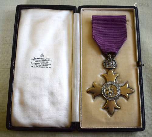 A GEORGE V SILVER GILT CASED OBE MEDAL in original fitted ca...