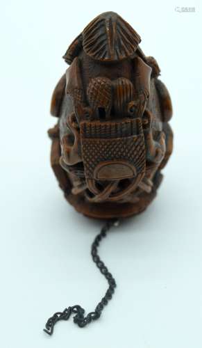 AN 18TH/19TH CENTURY FRENCH CARVED COQUILLA NUT SNUFF BOTTLE...