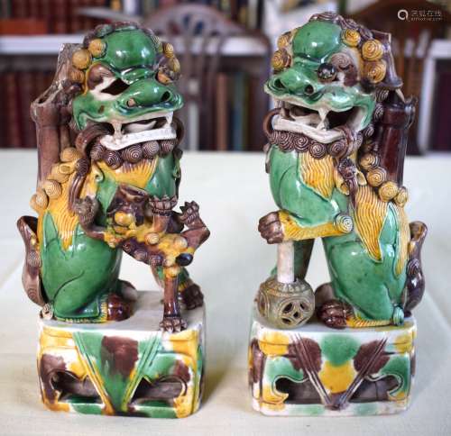 A PAIR OF 17TH CENTURY CHINESE EGG AND SPINACH GLAZED BUDDHI...