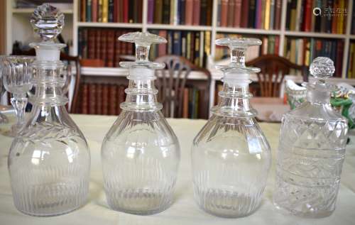 A PAIR OF ANTIQUE CUT GLASS DECANTERS AND STOPPERS together ...