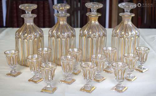 A SET OF FOUR 19TH CENTURY BOHEMIAN CLEAR AND GILDED LIQUOR ...