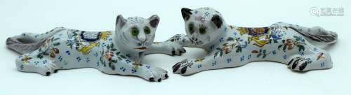 A PAIR OF ANTIQUE FRENCH FAIENCE TIN GLAZED POTTERY CATS pai...