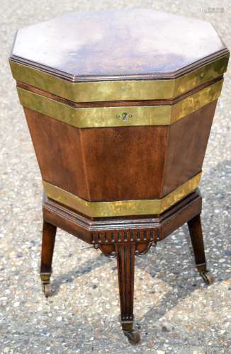 A GEORGE III MAHOGANY WINE COOLER ON STAND with brass mounts...