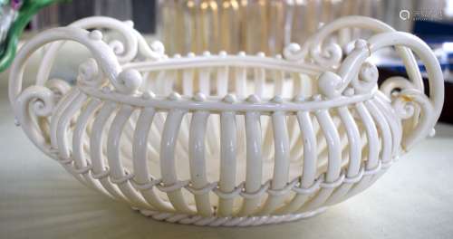 AN ANTIQUE CONTINENTAL CREAMWARE STYLE CHINA BASKET modelled...