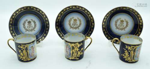 A SET OF THREE LATE 19TH CENTURY SEVRES PORCELAIN CUPS AND S...