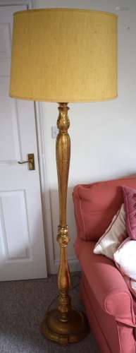 A REGENCY STYLE GILT PAINTED STANDARD LAMP with acanthus mou...