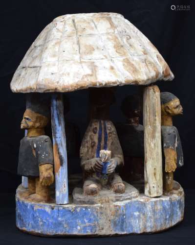 AN AFRICAN TRIBAL YORUBA PAINTED STOOL BASE and another. Lar...