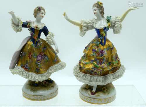 A PAIR OF ANTIQUE GERMAN PORCELAIN FIGURES painted in flower...