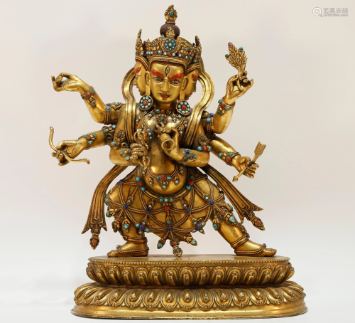 A gilt-bronze Tibetan statue