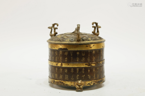 A bronze inlaying gold and silver container