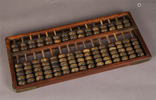 A CHINESE HUANGHUALI WOOD ABACUS