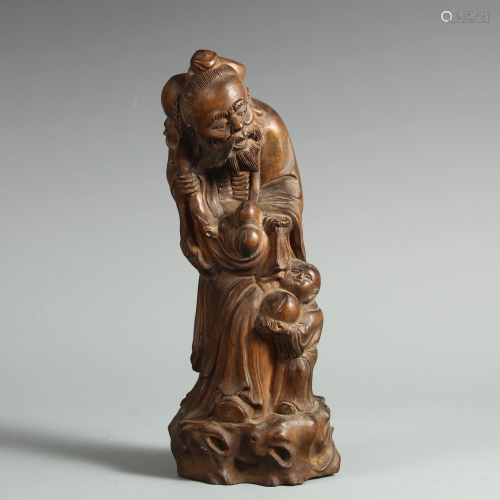 A CHINESE AGARWOOD CARVING OF THE GOD OF LONGEV…