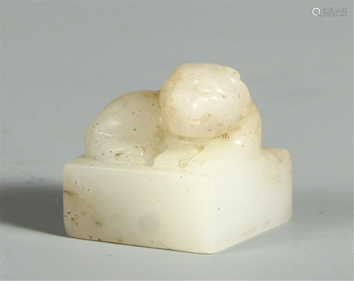A CHINESE JADE CARVED SEAL WITH BEAST HANDLE
