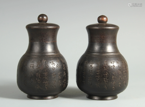 A PAIR OF CHINESE ZITAN WOOD BOTTLES WITH COVERS