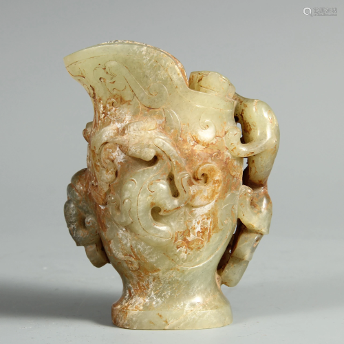 A CHINESE CARVED JADE CUP