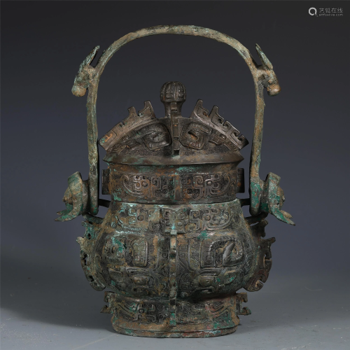 A CHINESE LOOP-HANDLED BRONZE VESSEL WITH COVER