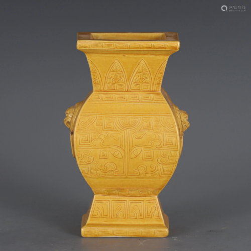 A CHINESE YELLOW GLAZED PORCELAIN VASE WITH CARVED
