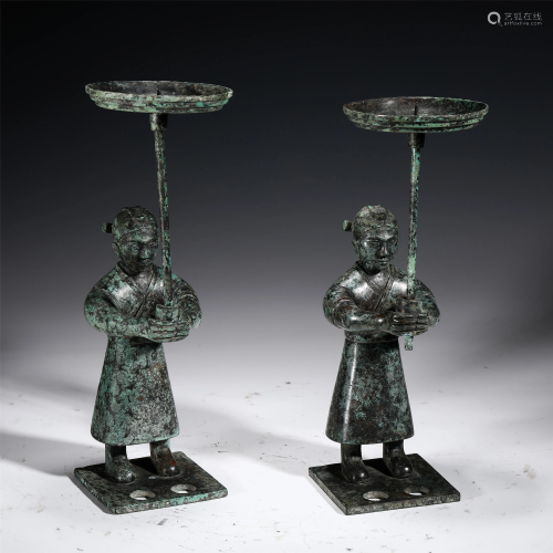 A PAIR OF CHINESE HUMAN SHAPE BRONZE CANDLE HOLDERS