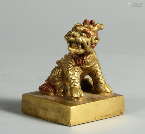 A CHINESE GILT BRONZE SEAL WITH BEAST HANDLE