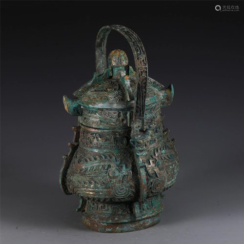 A CHINESE LOOP-HANDLED BRONZE POT WITH BEAST DESIGNS