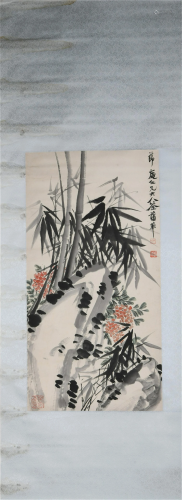 A CHINESE SCROLL PAINTING OF BAMBOOS AND FLOWERS