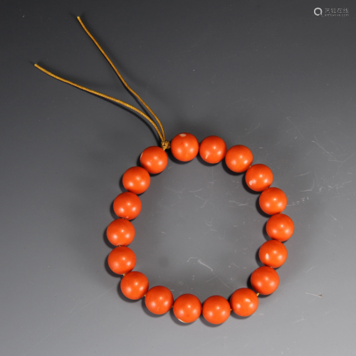 A CHINESE CARVED CORAL BRACELET