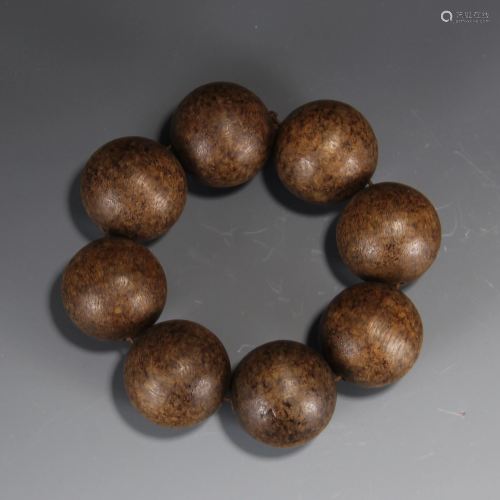 A CHINESE CARVED AGARWOOD BRACELET