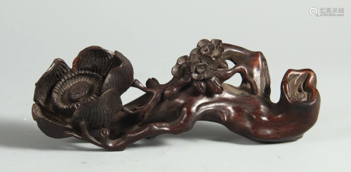 A CHINESE ZITAN WOOD BRUSH REST WITH FLOWER CARVINGS