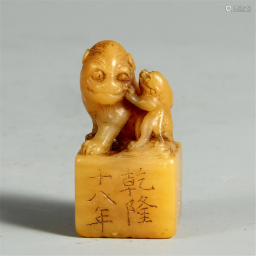 A CHINESE SOAPSTONE SEAL WITH BEASTS HANDLE