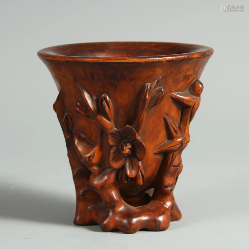 A CHINESE BOXWOOD CUP WITH FLOWER CARVINGS