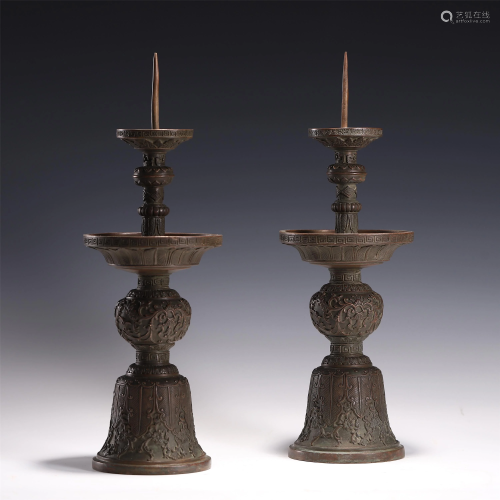 A PAIR OF CHINESE BRONZE CANDLE HOLDERS