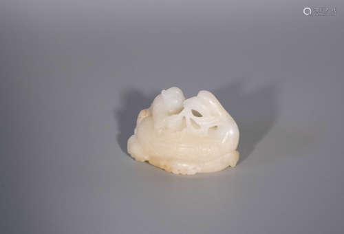 Qing dynasty, QIAN LONG, hetian jade carving of a kid holdin...