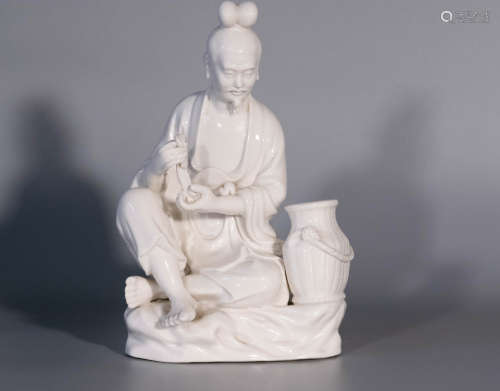 Qing dynasty, De Hua kiln porcelain sculpture of fisherman