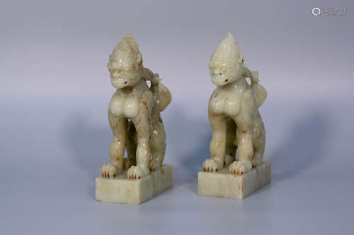 A pair of yellow jade carved auspicious beast