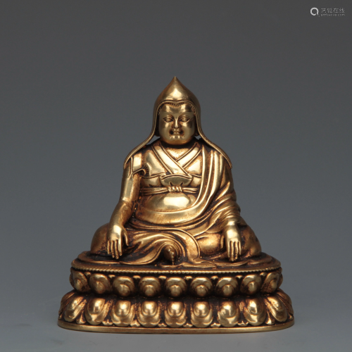 A Bronze Seated Master
