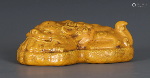 A Yellow Glazed Paper Weight