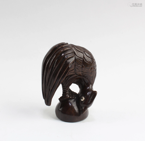 A Carved Wooden Rooster Figurine