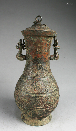 A Bronze Jar With Lid