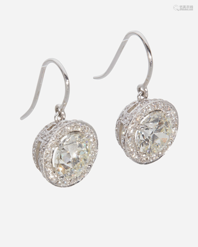 A pair of diamond drop earrings