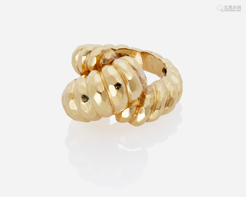 A gold fluted knot ring