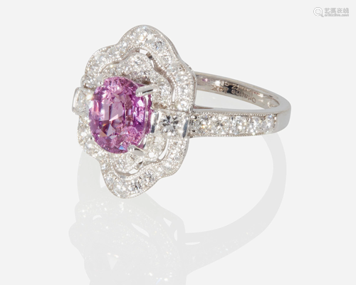 A pink sapphire and diamond ring