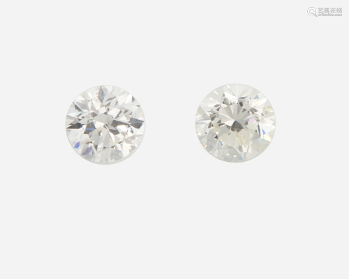 Two unmounted round diamonds